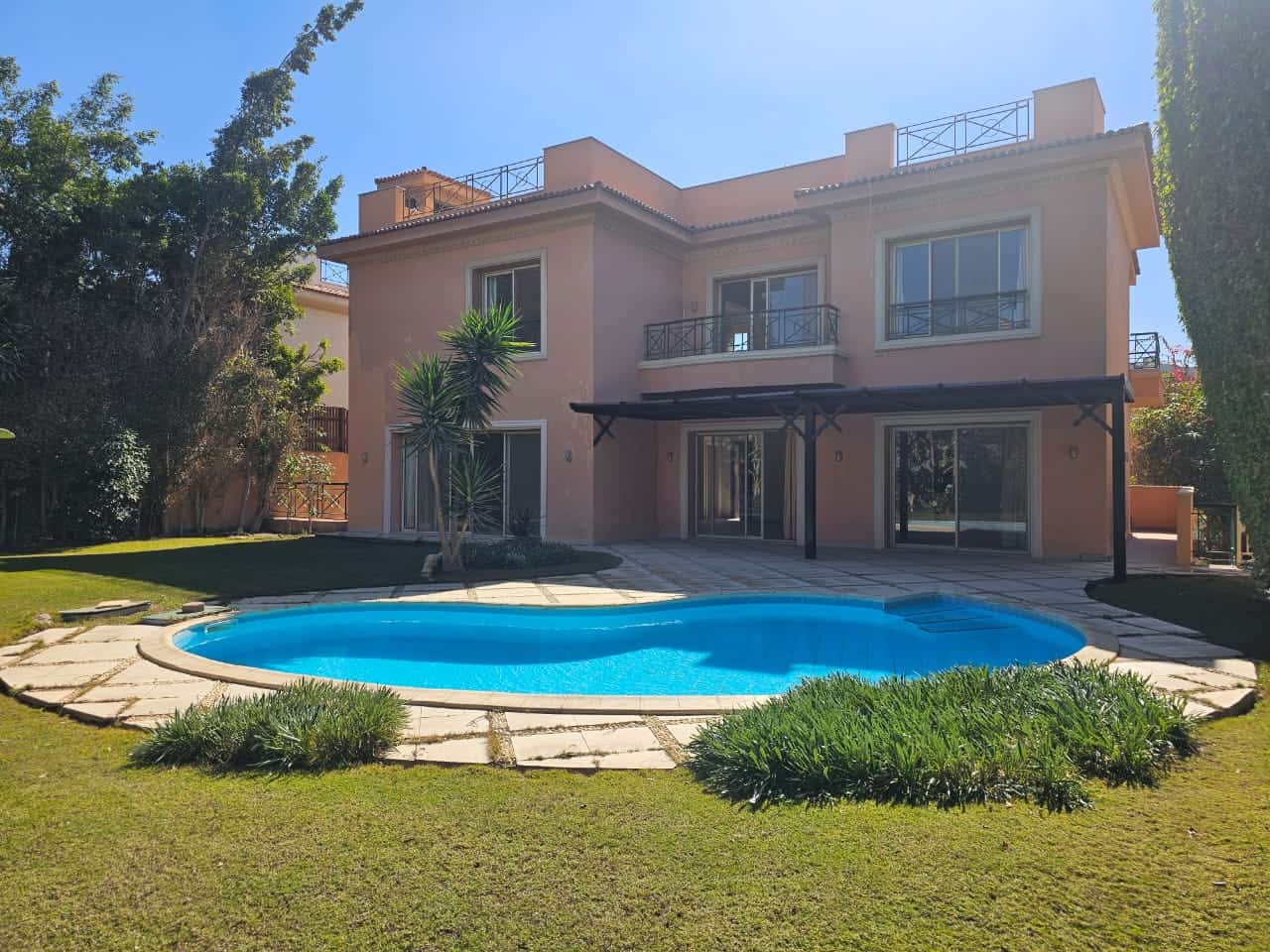 Elegant villa in Maadi, Cairo with a private pool and lush garden for rent.