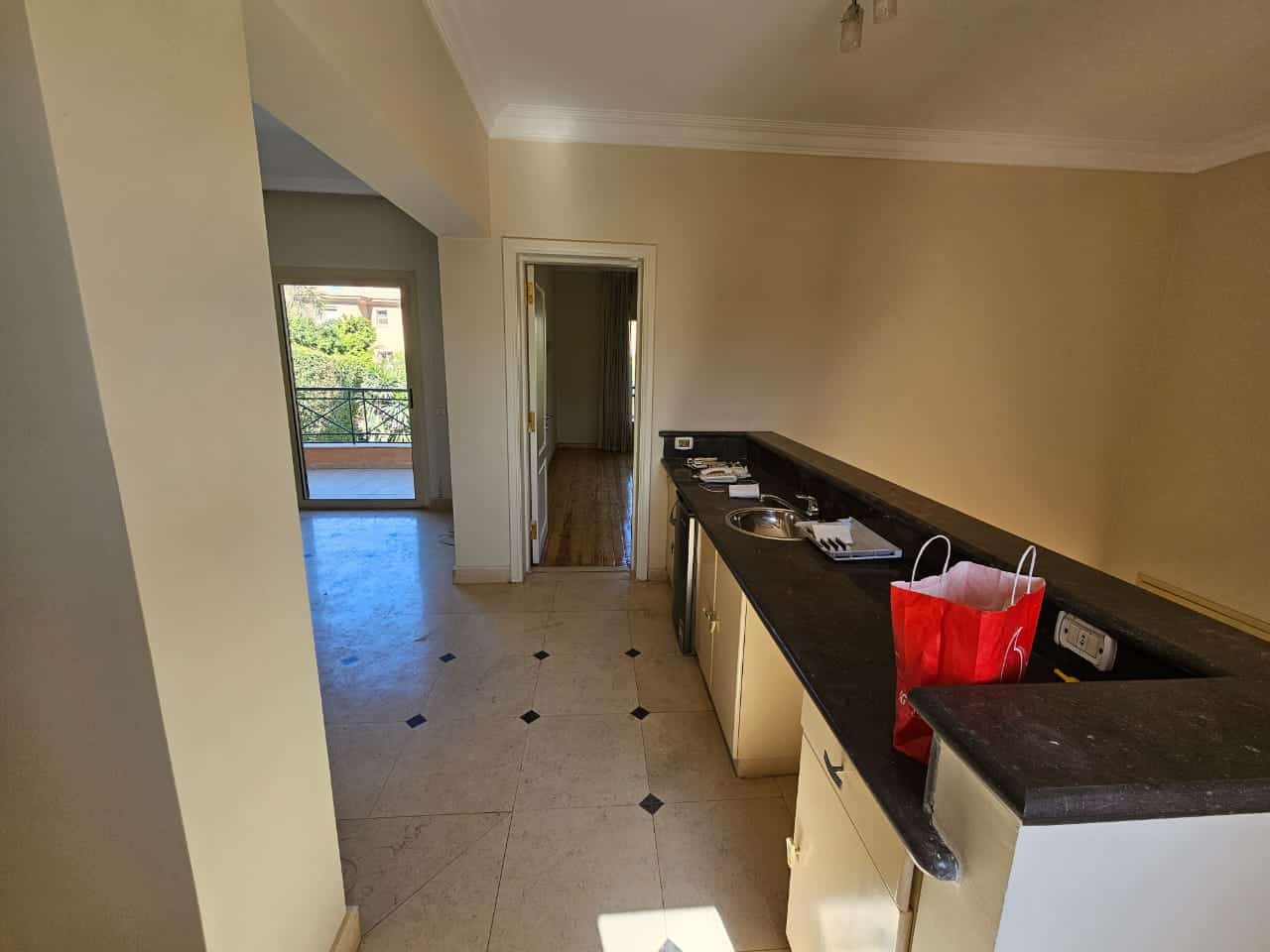 Modern apartment kitchen with balcony access in Maadi Cairo Egypt.