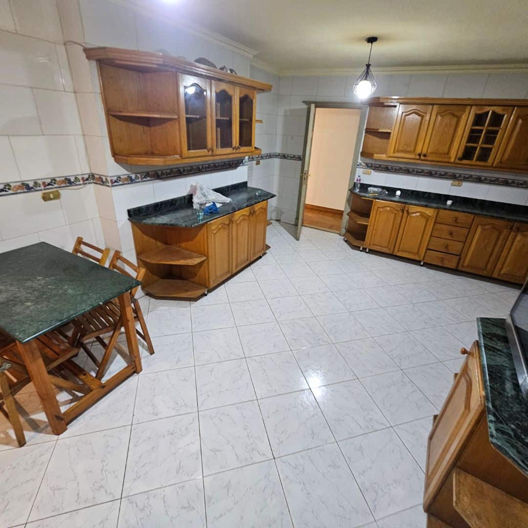 Comfortable wooden kitchen cabinets in Maadi Cairo apartment.