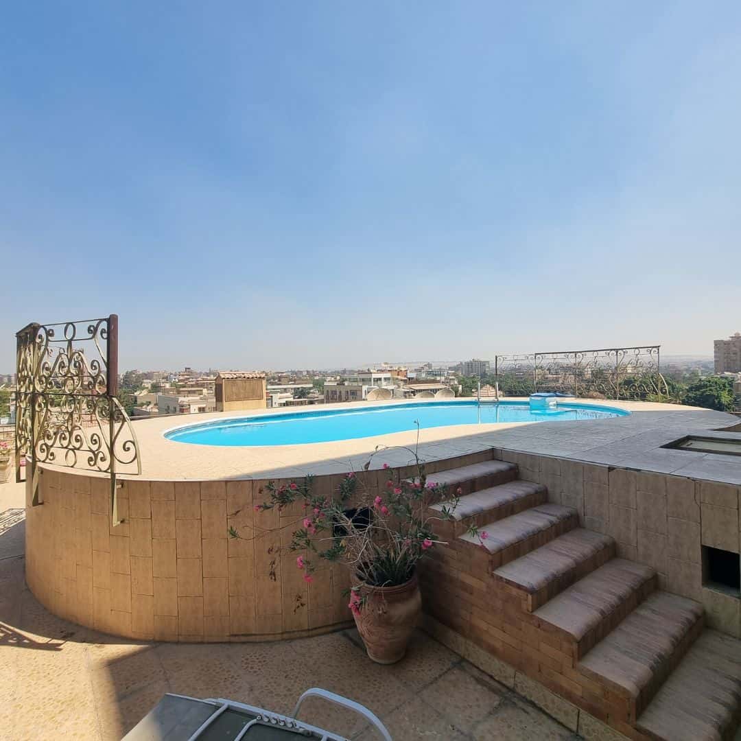 Luxurious rooftop pool with panoramic city views in Maadi Cairo Egypt.